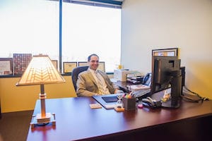 Photo of James V. DiTommaso at his Desk